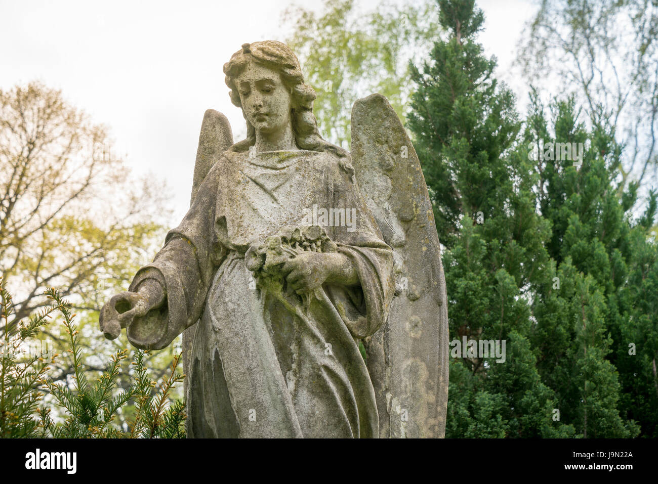 old sculpture of an angel in nature. Unknown artist of the 19th Stock ...