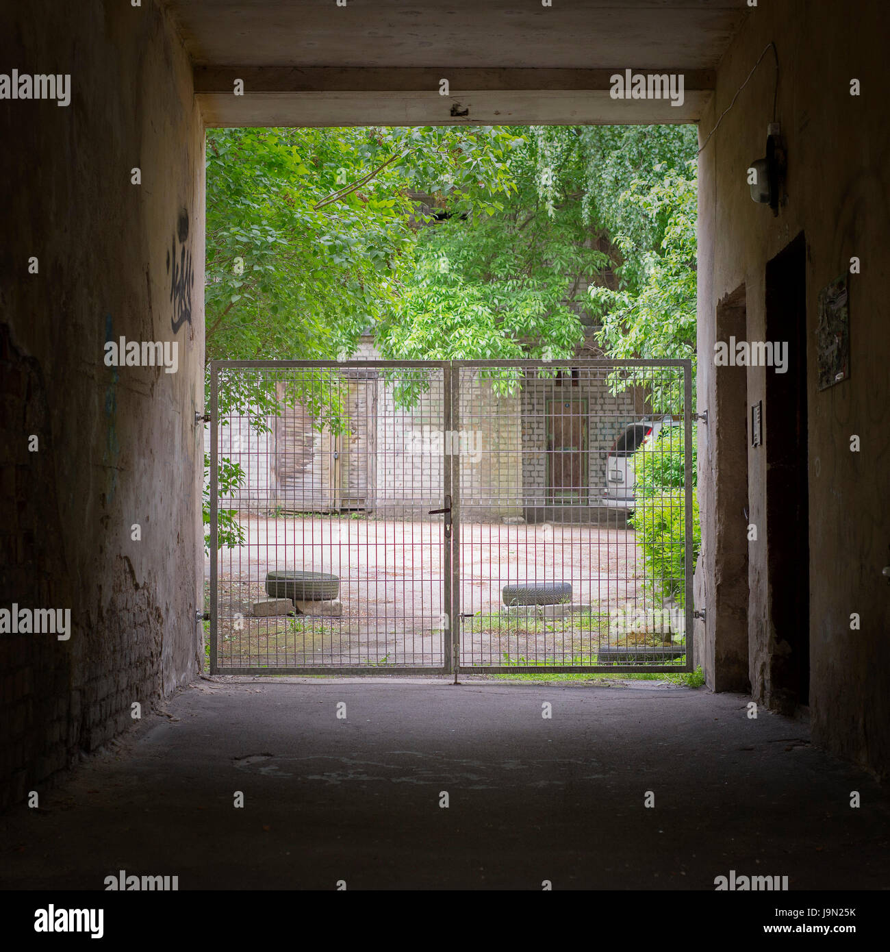 Tunnel and gates to the yard Stock Photo Alamy