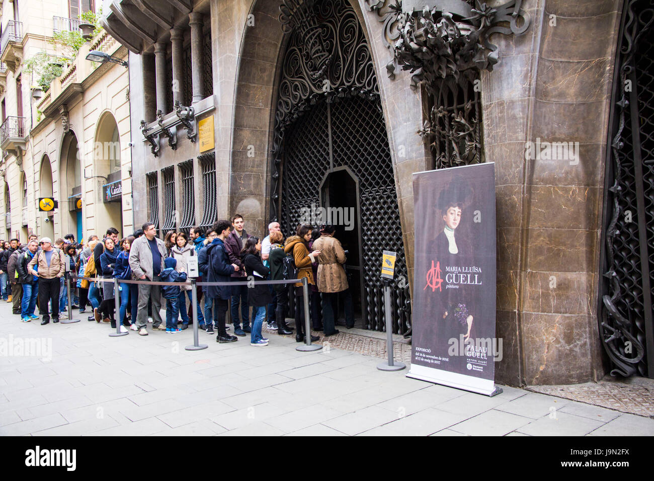 There's usually a crowd eager to enter Palau Guell, an elaborate mansion designed by architect Antoni Gaudi in 1886-1888, in Barcelona, Spain Stock Photo