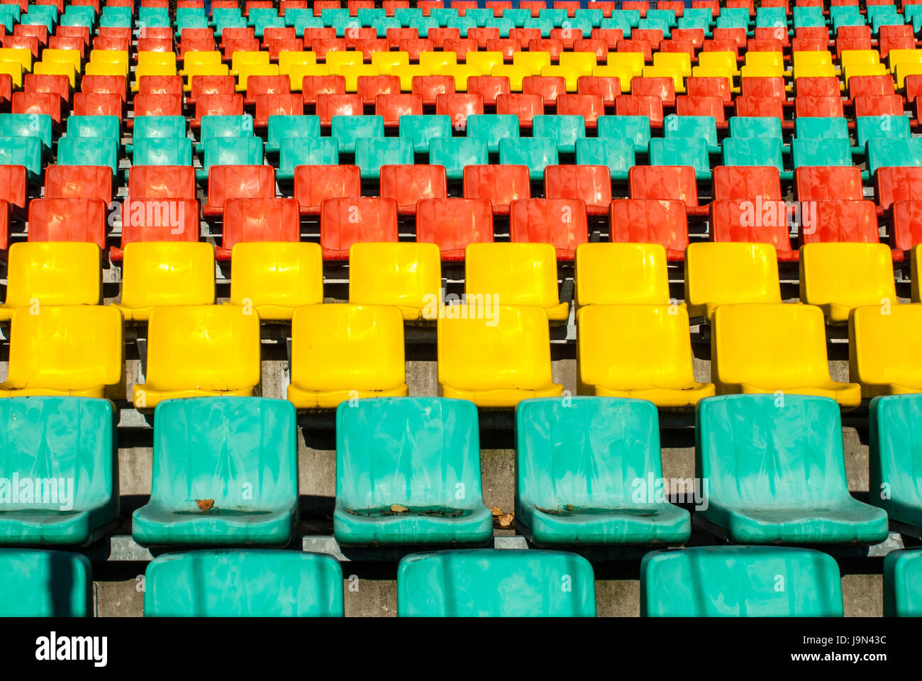 colored emty seats in a sport stadium Stock Photo Alamy