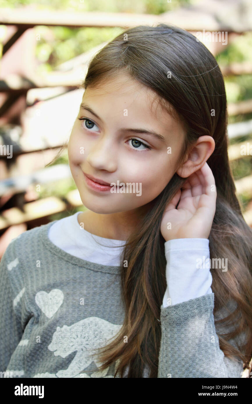 Young pre-teen kid with long hair. Stock Photo