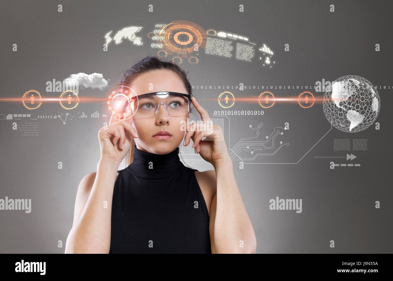 Woman with futuristic smart glasses on grey background Stock Photo - Alamy