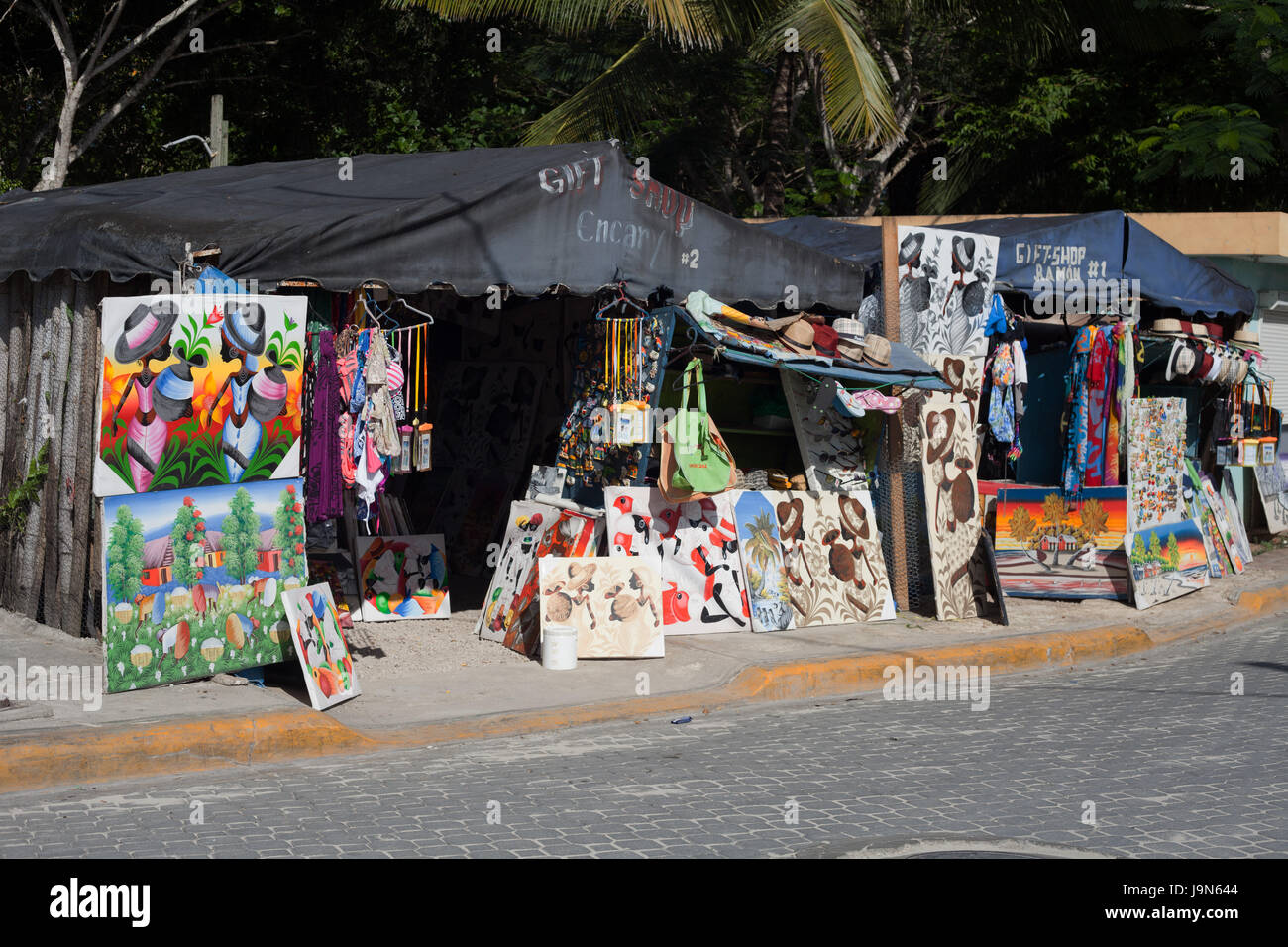Local art and souvenirs sold on the street by Bayahibe harbour, Dominican Republic Stock Photo