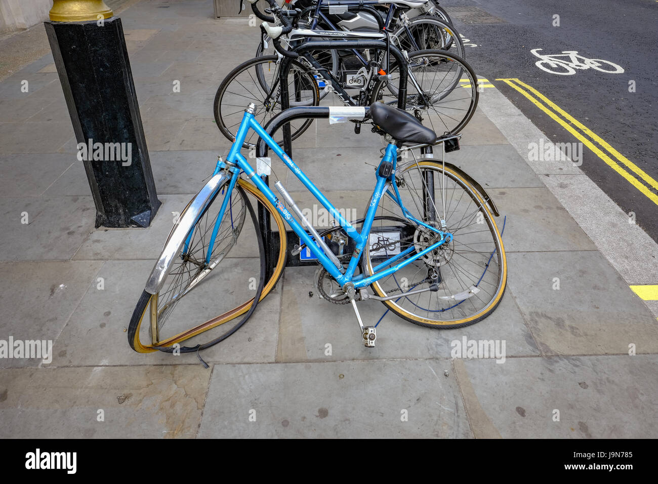 London UK - May 11, 2017:  Broken and crushed blue bicycle Stock Photo