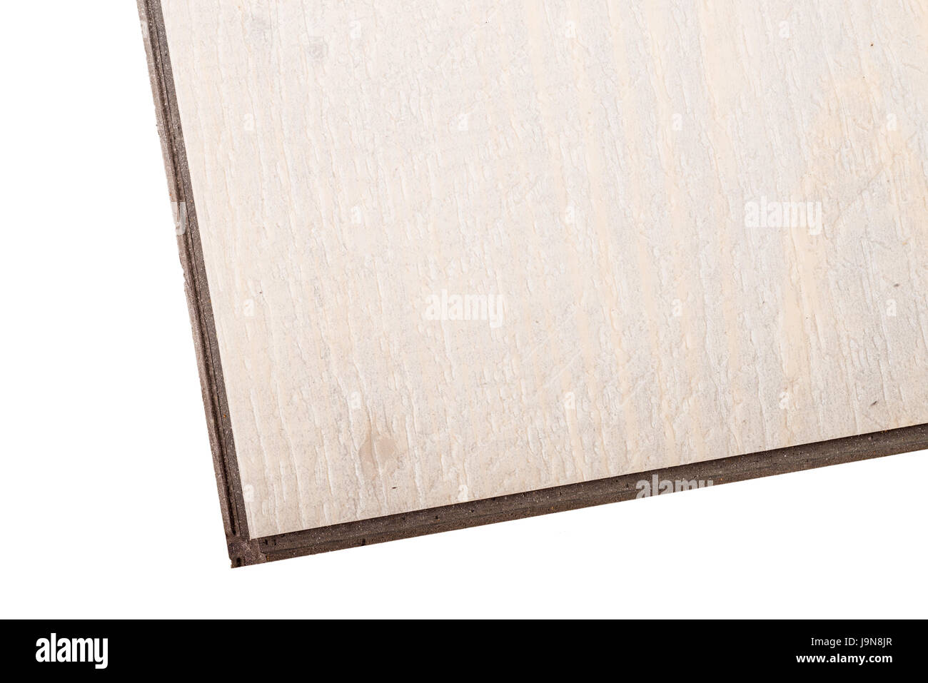 Detail take of a vinyl floating flooring tile whit its lip and grooves to click into each other Stock Photo