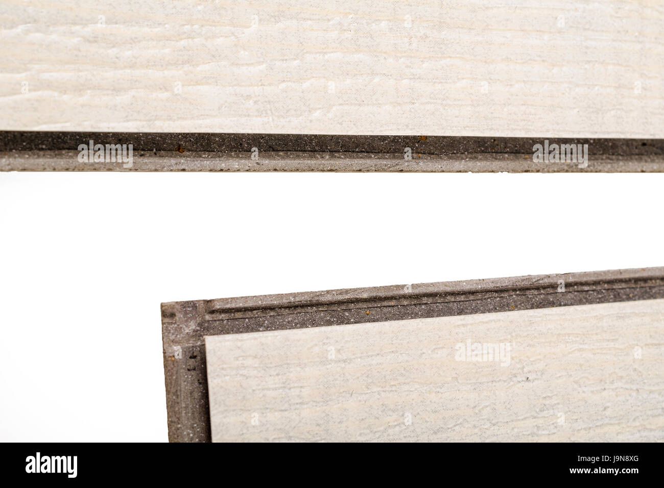 Detail take of a vinyl floating flooring tile whit its lip and grooves to click into each other Stock Photo