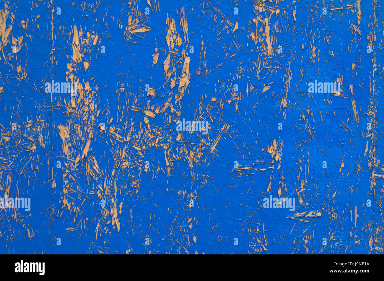 Blue painted chipboard texture. Construction panel. Shabby paint