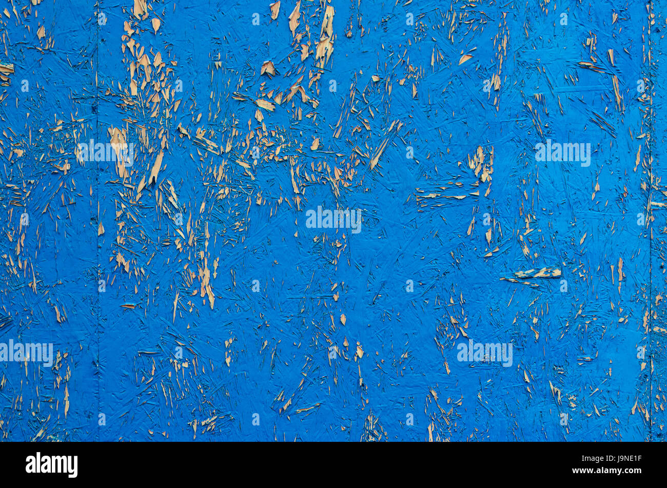 Blue painted chipboard texture. Construction panel. Shabby paint