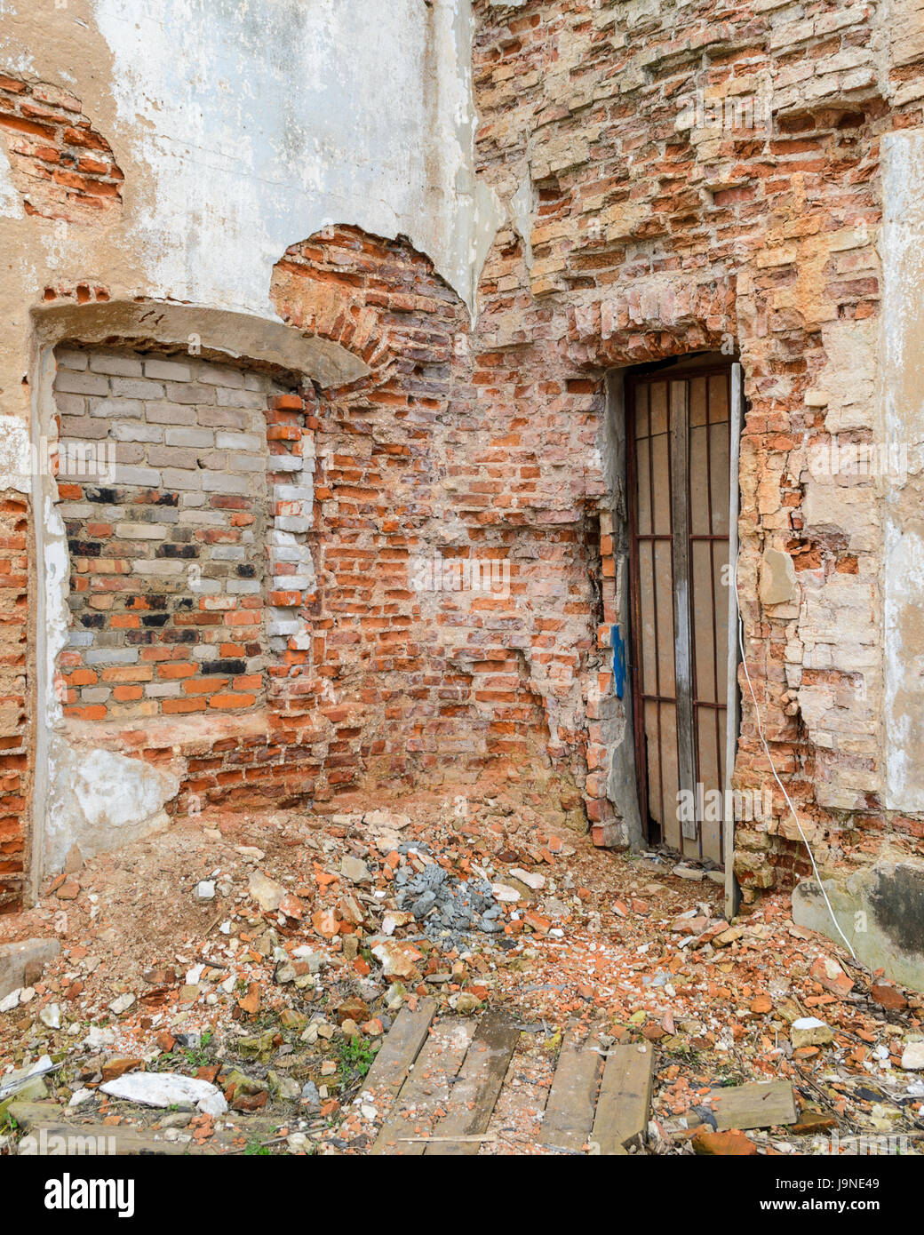 The facade of the old brick building collapses time and weather Stock ...