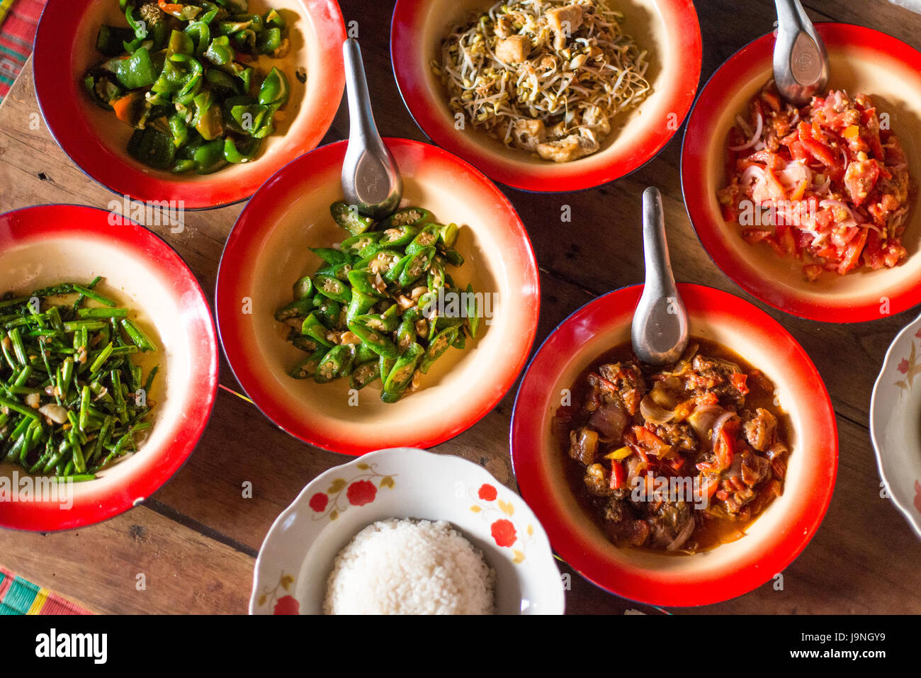 Bowls of food in small village in Myanmar Stock Photo