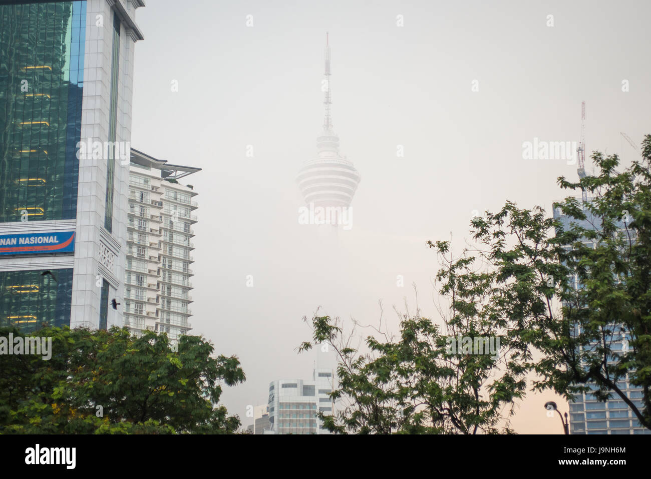 The KL Tower was basically disappearing in the waning light of day. Stock Photo