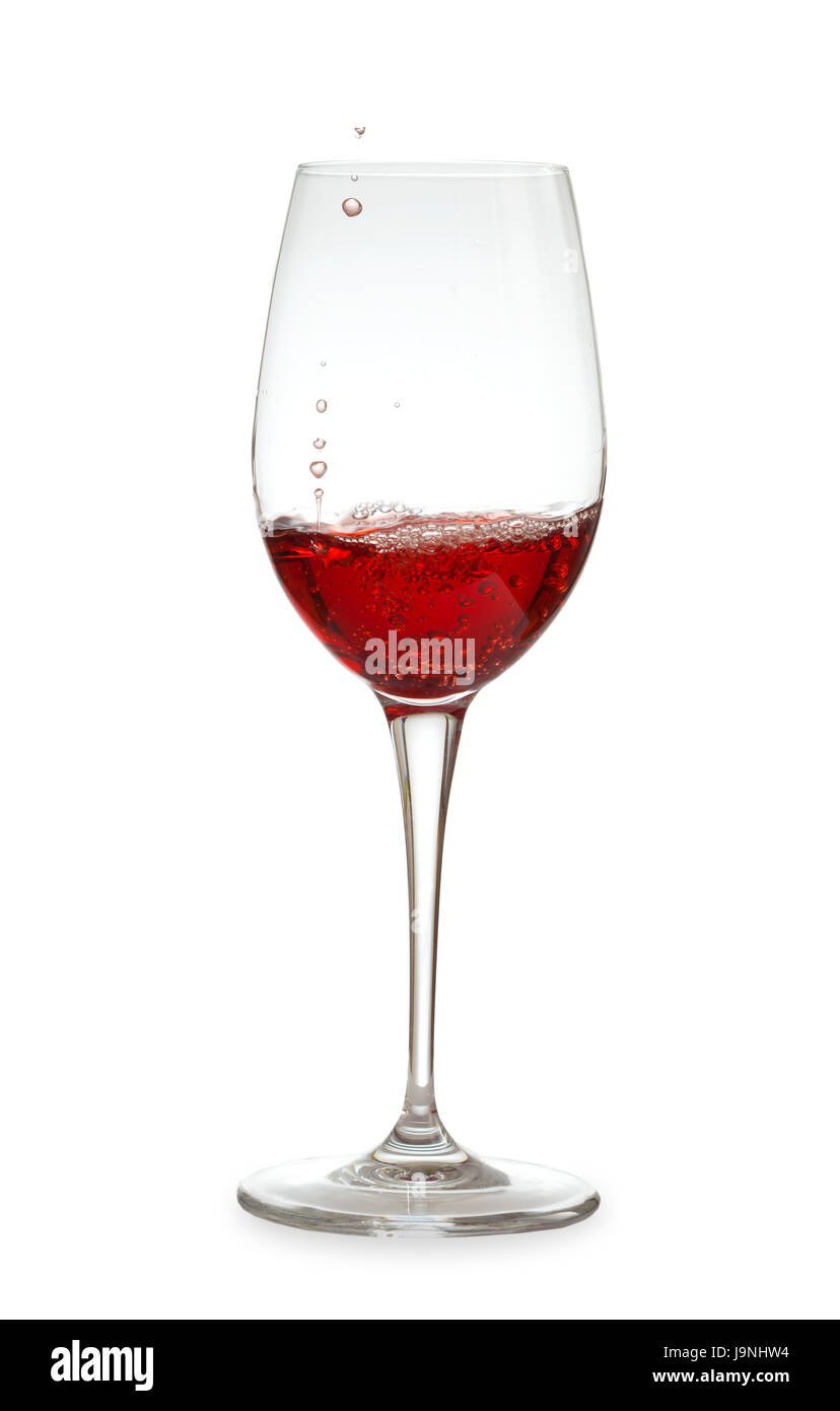 rose wine being poured into a crystal glass, last drops, on white Stock Photo