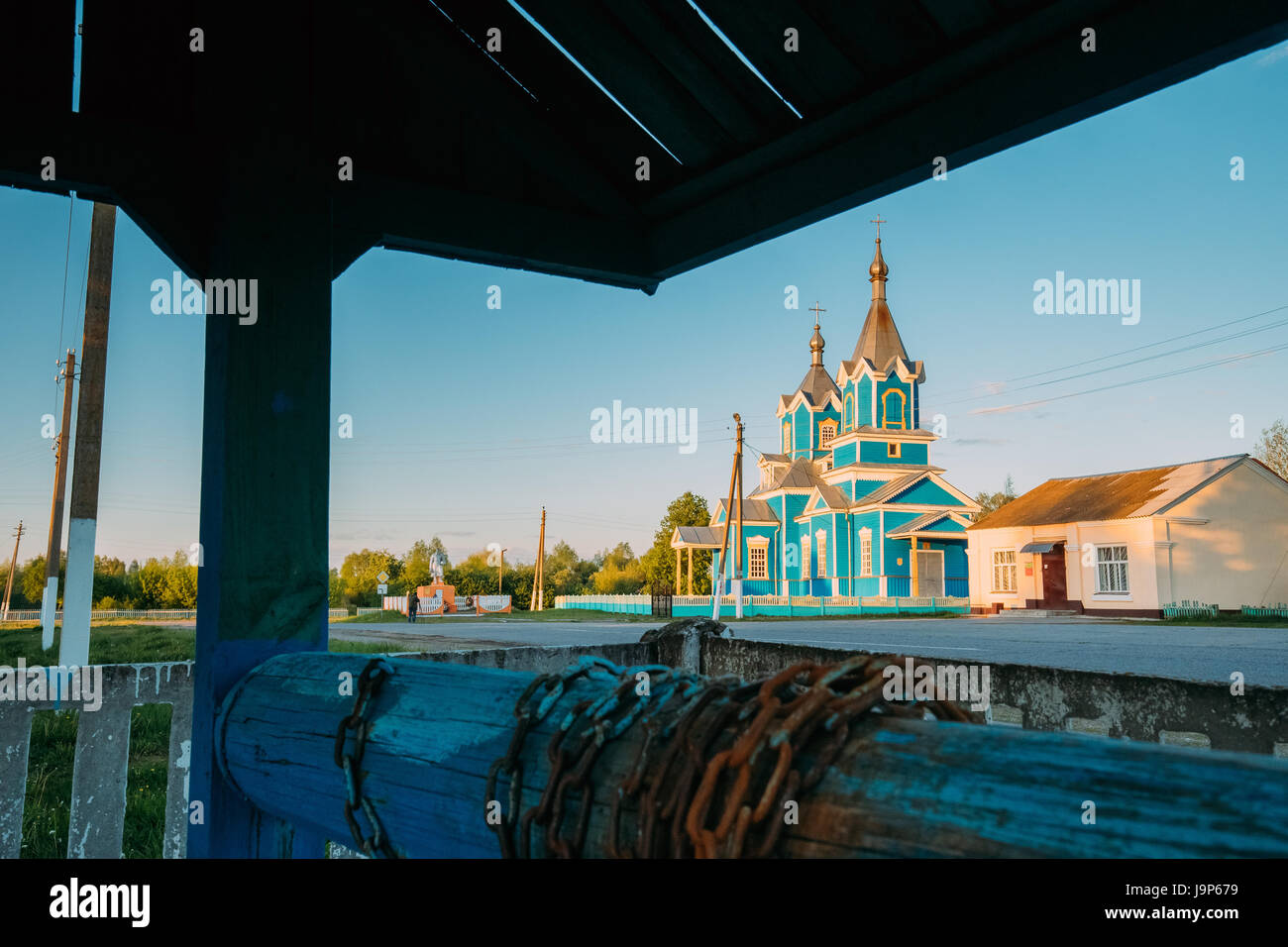 Old Wooden Orthodox Church Of The Nativity Of The Virgin Mary At Sunset In Village Krasnyy Partizan, Dobrush District, Gomel Region, Belarus. View Fro Stock Photo