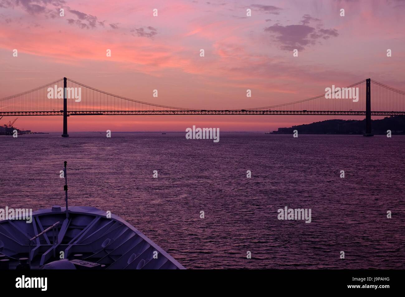 Lisbon - 25 de Abril Bridge and The Sanctuary of Christ the King Monument Stock Photo