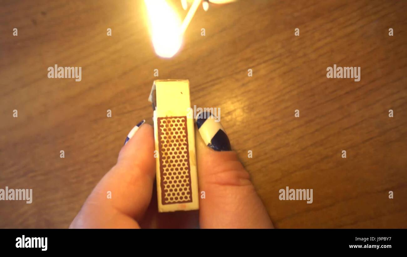 Hand holding a lit match hires stock photography and images Alamy
