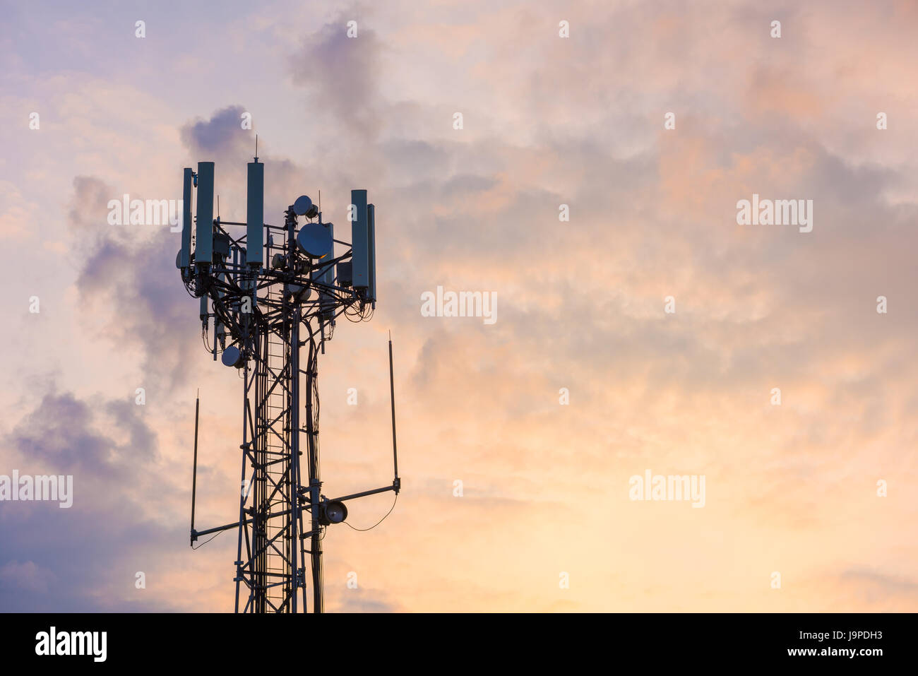 A mobile (or cellular) phone base transceiver station antenna array at Aust, Gloucestershire, England. Stock Photo