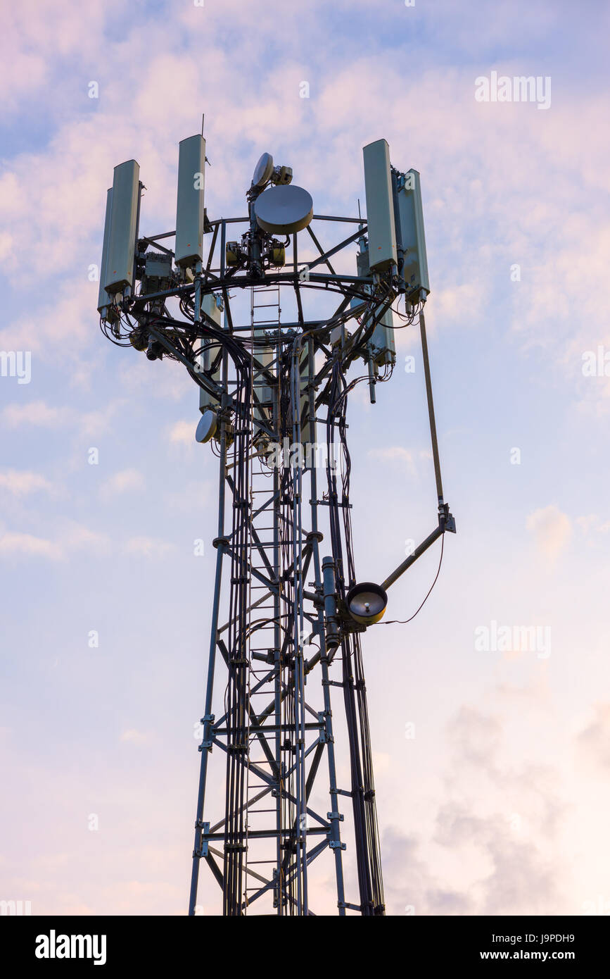 A mobile (or cellular) phone base transceiver station antenna array at Aust, Gloucestershire, England. Stock Photo