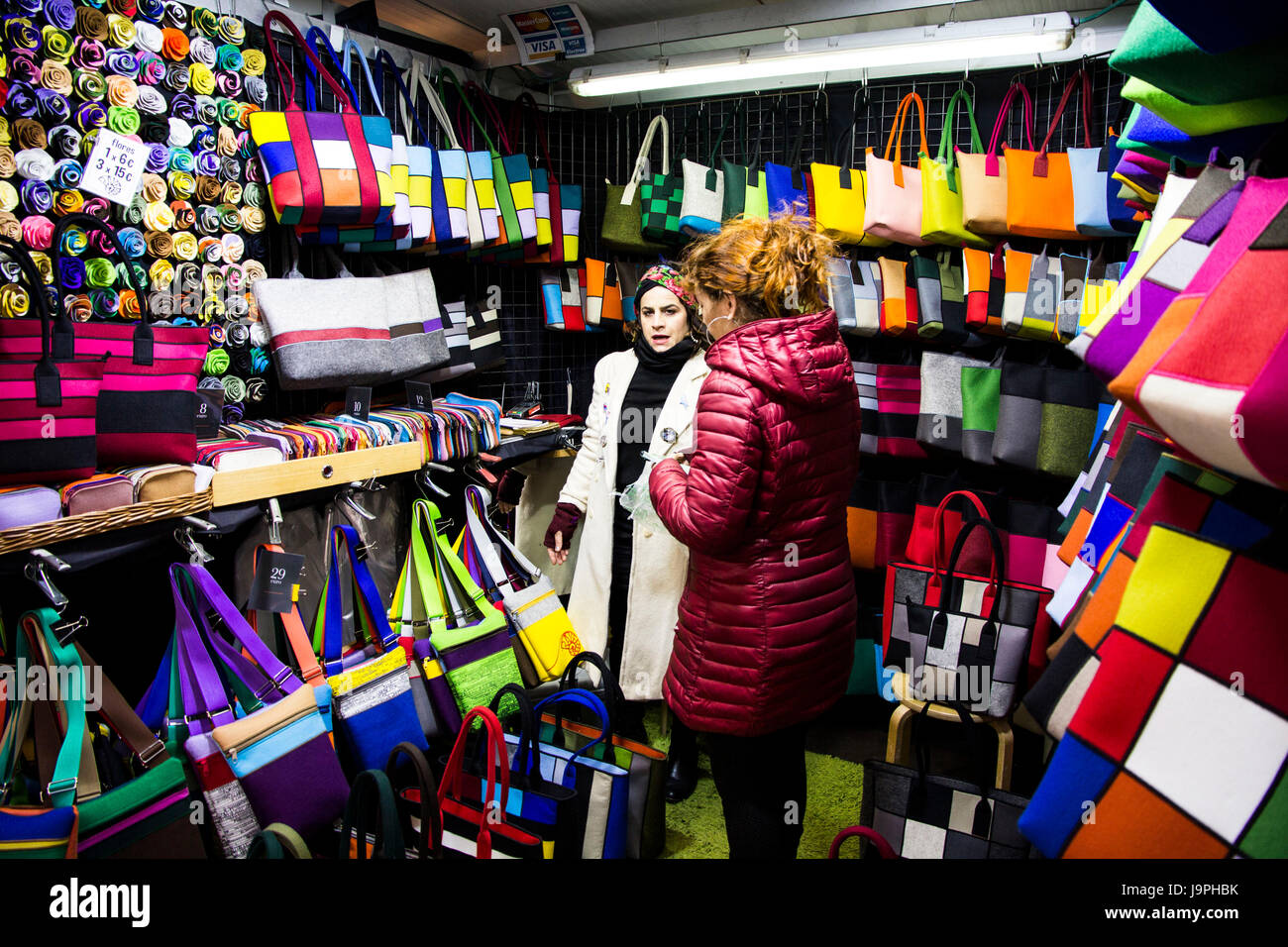 This shop on Portal de L'Angel features and array of colorful handbags, Barcelona, Spain. Stock Photo