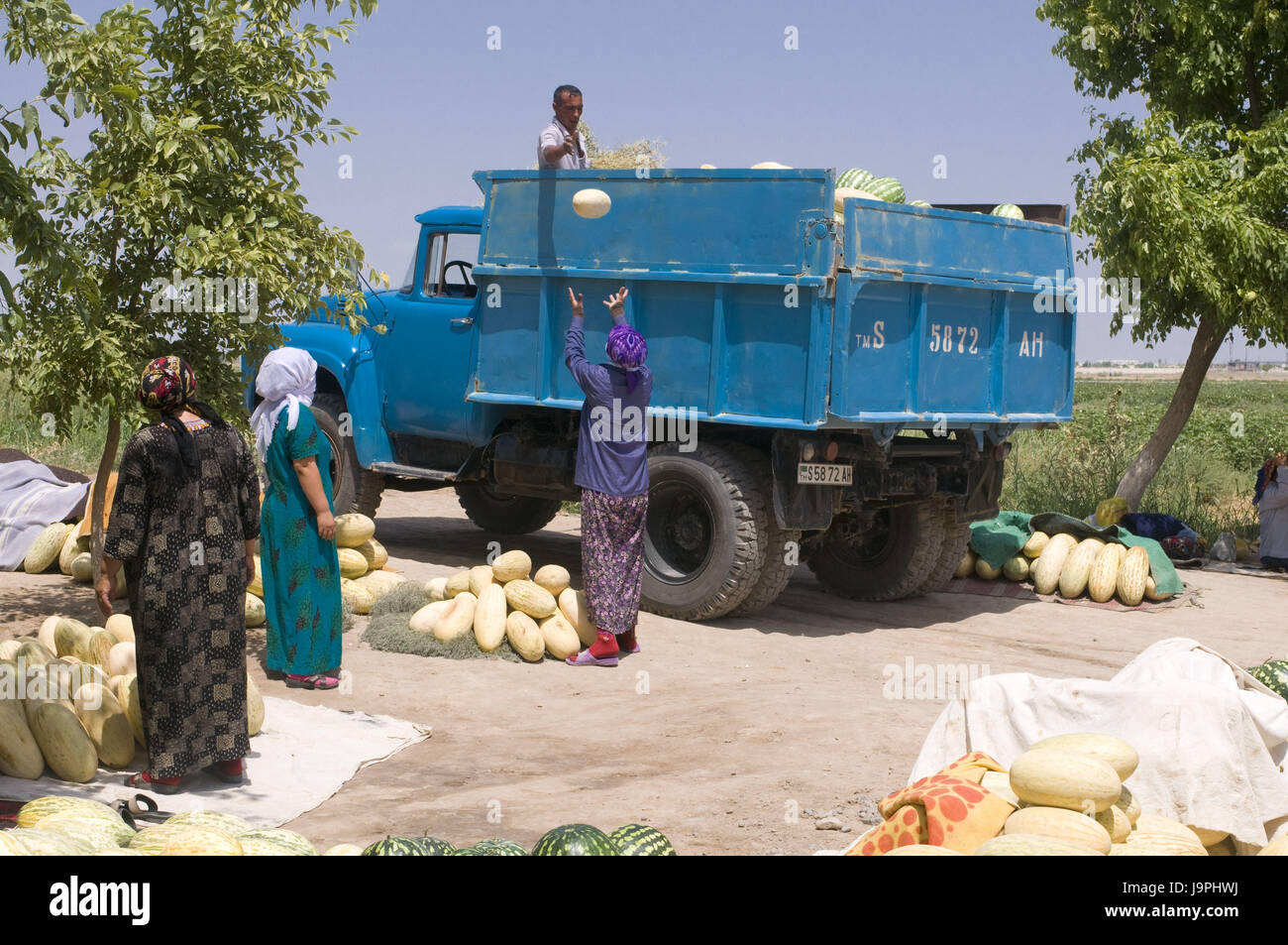 People carry melons and other fruits,Turkmenistan, Stock Photo