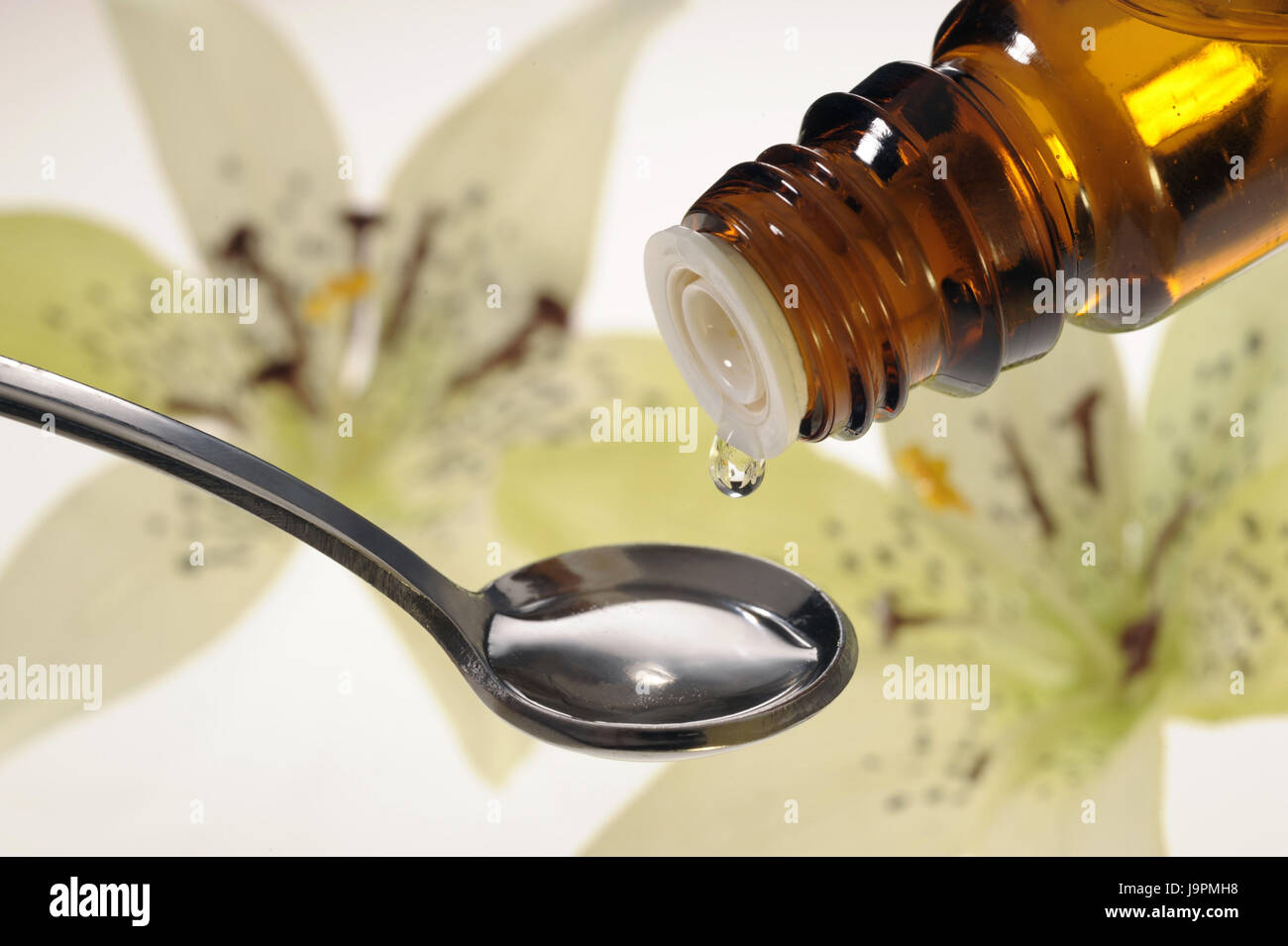 Nature medicine,homoeopathy,spoon,drop,vegetable active ingredients, Stock Photo