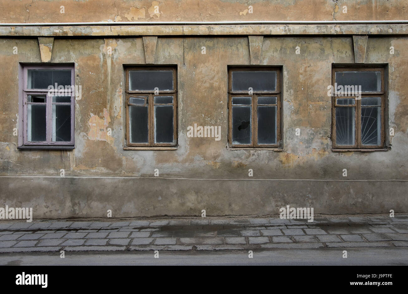Lithuania,Vilnius,Old Town,house,old,building,empty,facade,dreary,defensive wall,window,sidewalk,street,cracks,weather-beaten,exit,neglected,dilapidatedly,slice,broken,architecture,oblivion,recollections,loneliness,melancholia,past,stagnation,vacuousness,nobody,outside, Stock Photo