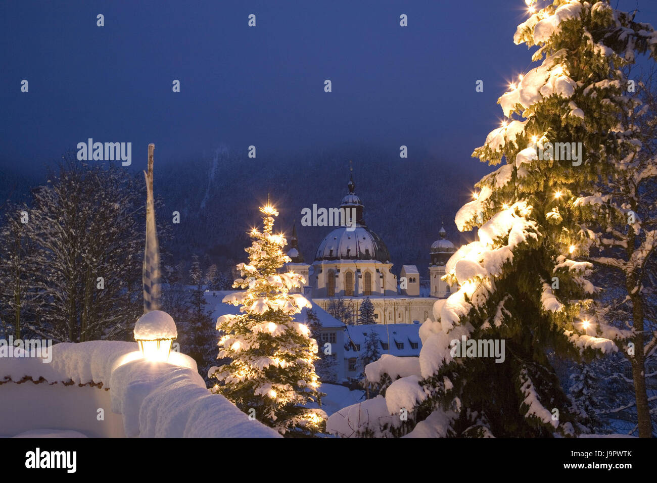 Germany,Bavaria,upper bunting's region,cloister of Ettal,minster,Christmas trees,winter,evening,Upper Bavaria,cloister attachment,Benedictine's abbey,church,domed building,baroque church,structure,architecture,place of interest,destination,tourism,conception,faith,religion,Christianity,snow,snow-covered,lights,yule tide,Christmas, Stock Photo