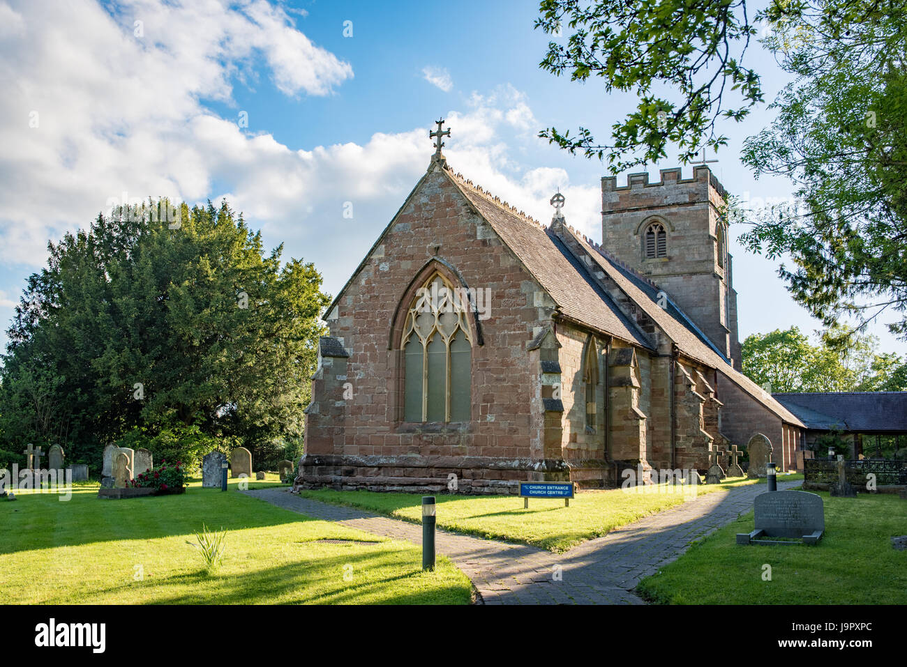 Ipsley church in Redditch with a sunny blue sky in the background Stock Photo