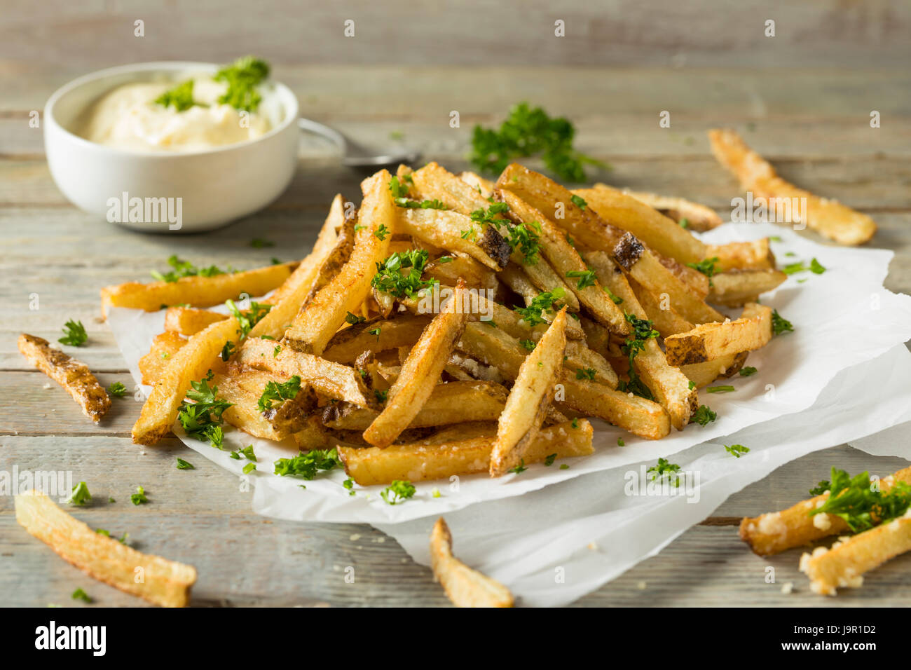 Homemade Parmesan Truffle French Fries with Parsley and Mayo Stock