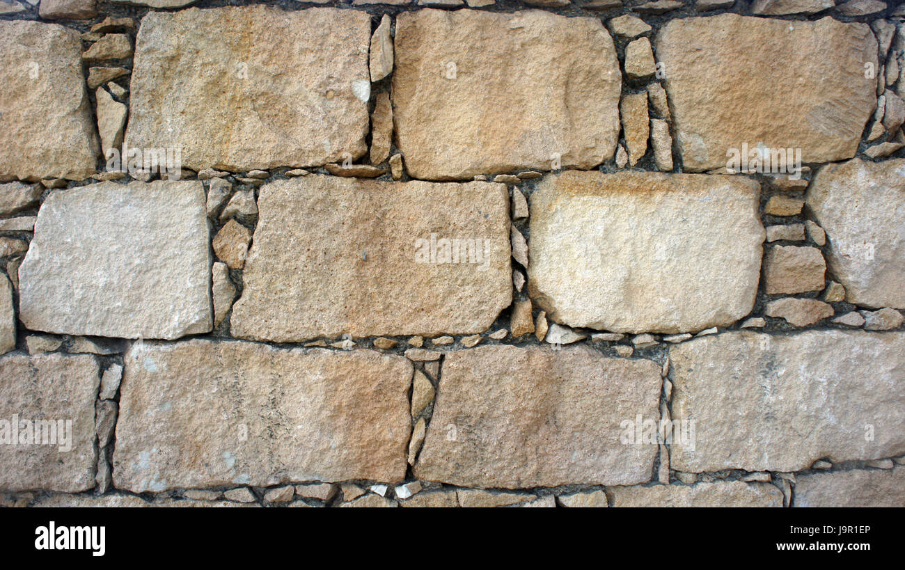 Old Cobblestone wall. Background and textures photography. Stock Photo