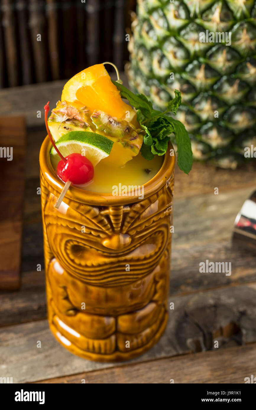 Refreshing Cold Tiki Drink Cocktails with Pineapple Cherry Orange