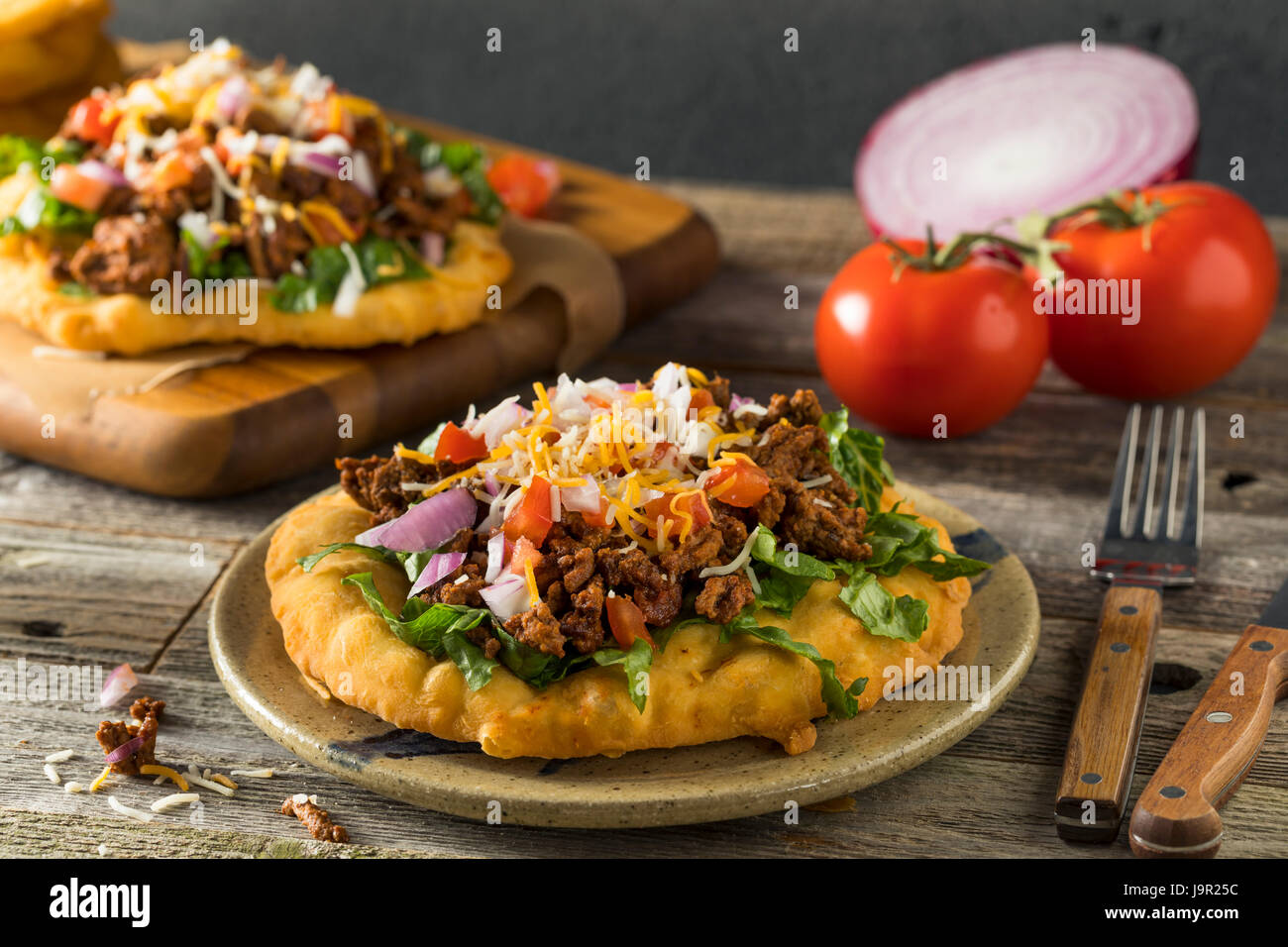Homemade Indian Fry Bread Tacos with Ground Beef Lettuce and Tomato Stock Photo