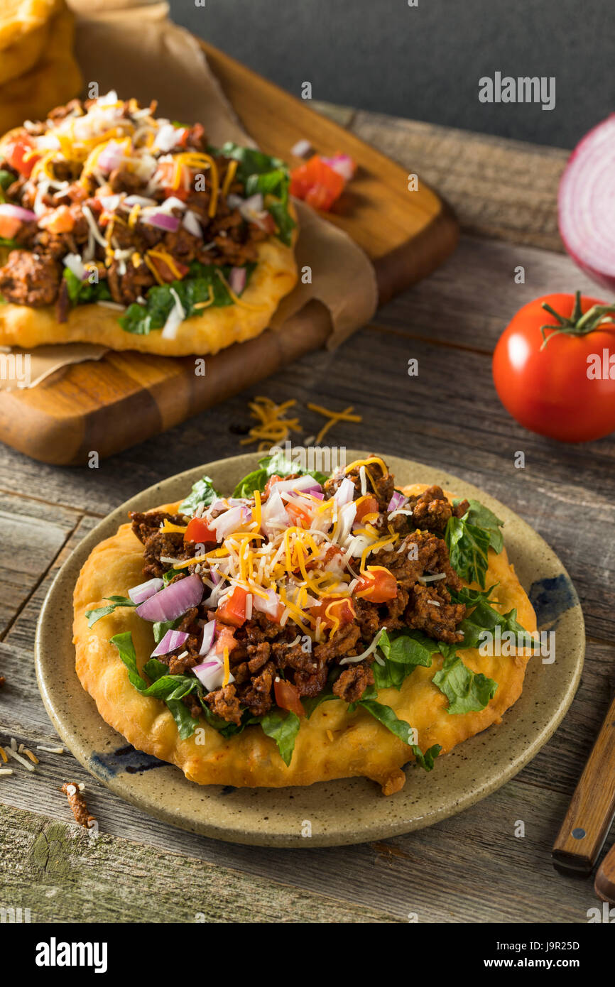 Homemade Indian Fry Bread Tacos with Ground Beef Lettuce and Tomato Stock Photo