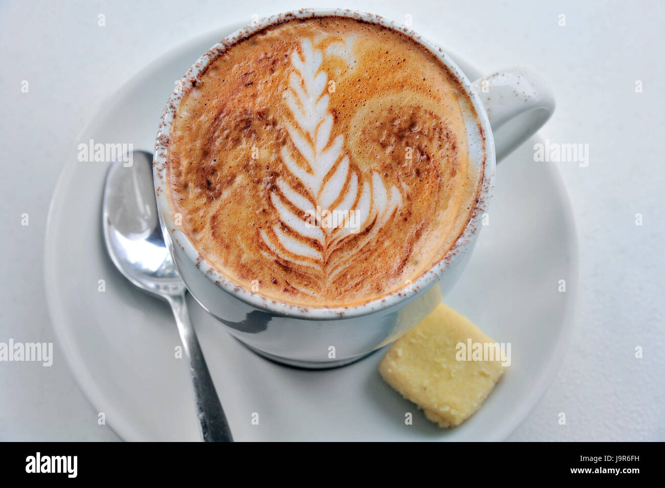 Typical Australian style coffee with illustrative cream topping. Stock Photo