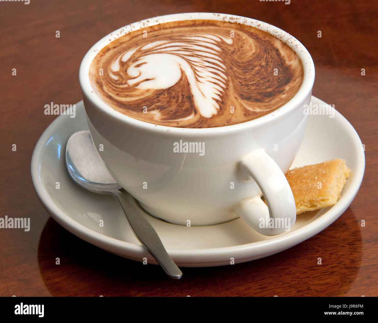Typical Australian style coffee with illustrative cream topping. Stock Photo
