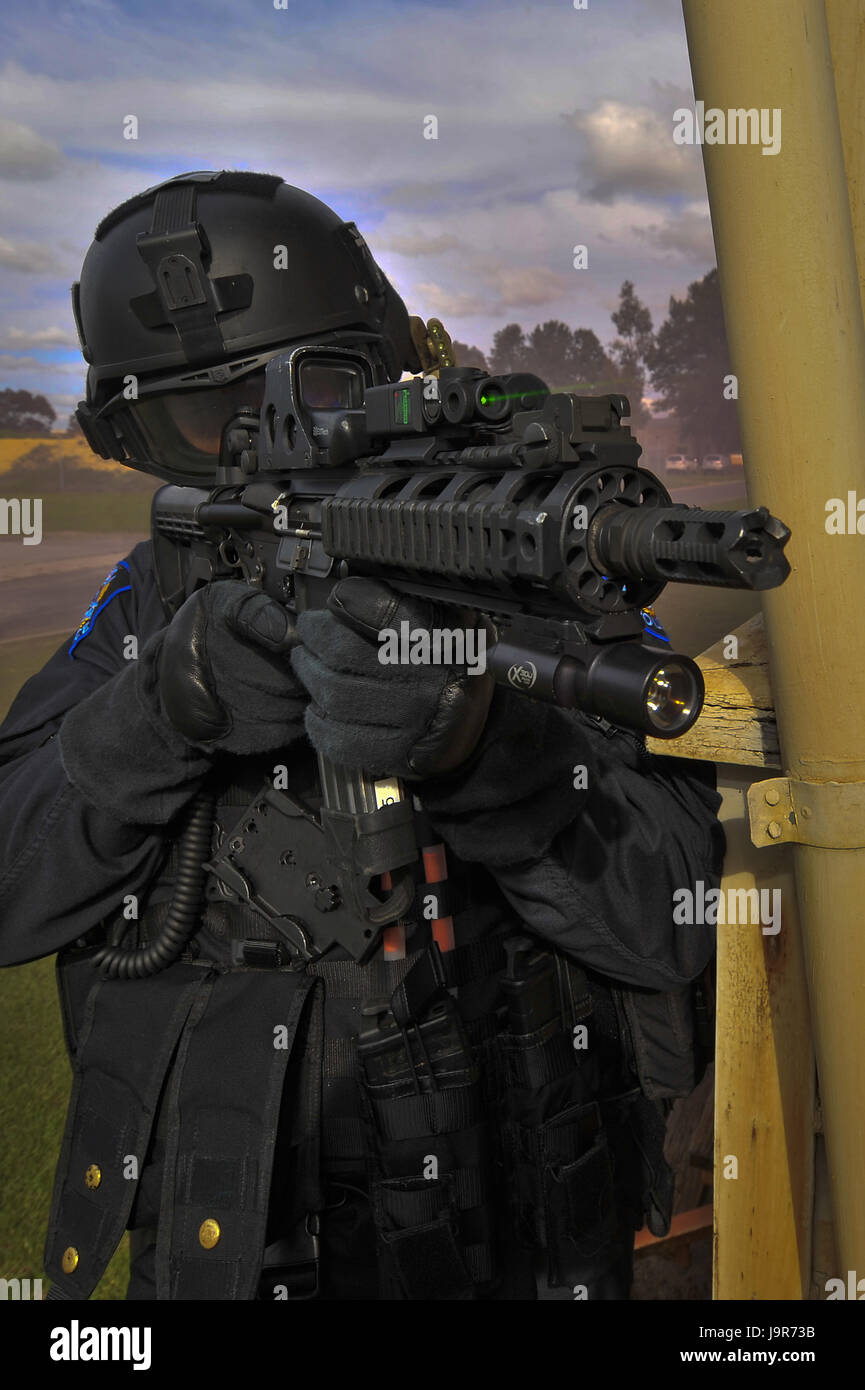 Western Australian Police, rapid response team in action, using laser sighted assault rifles. Stock Photo