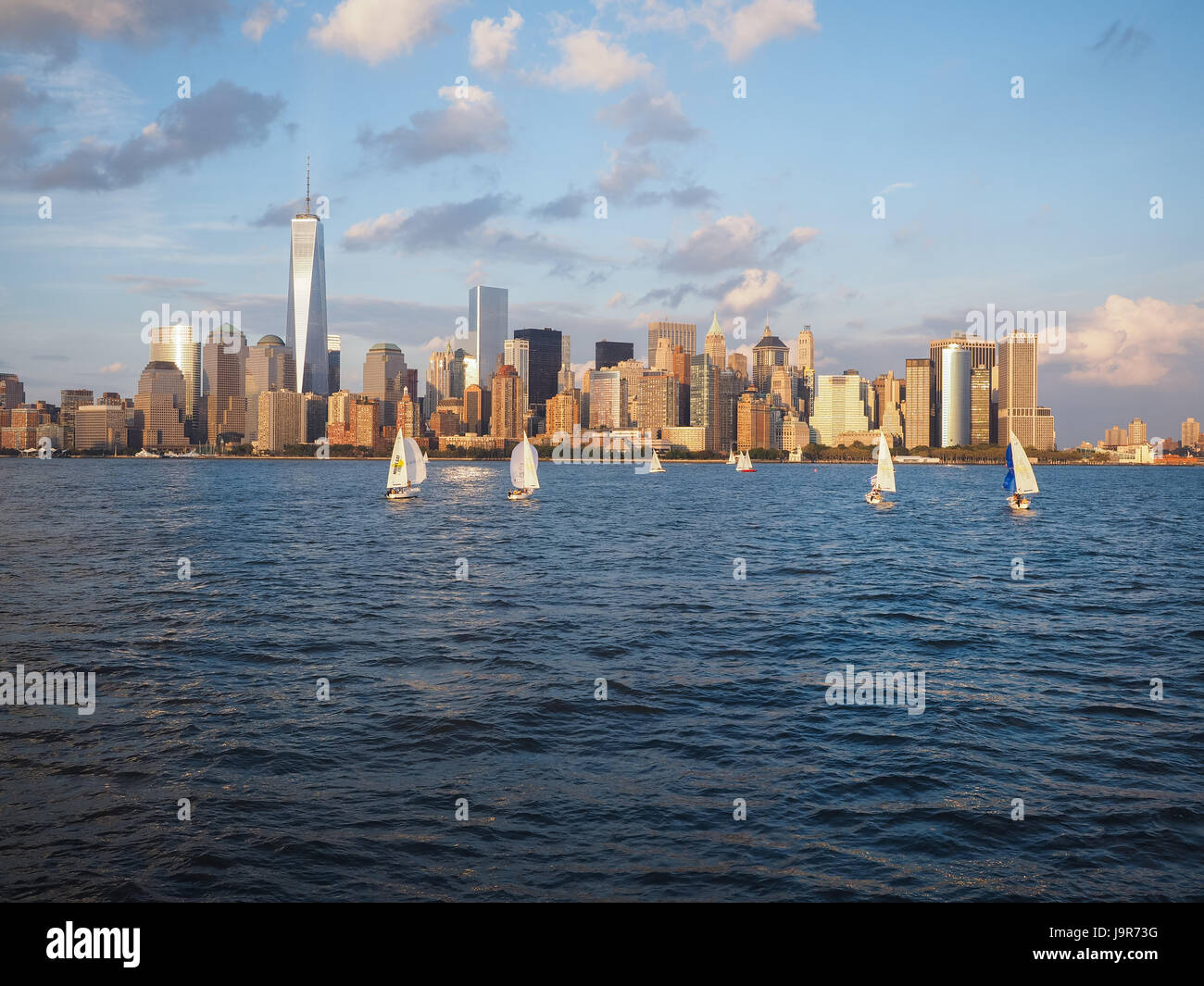 J24 Sailboats sailing on the Hudson River with a view of the New York