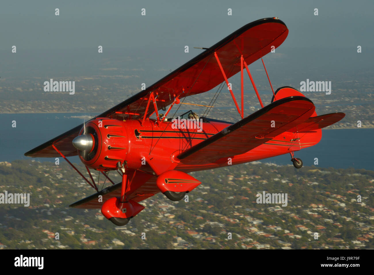 WACO YMF-5D new build period biplane photographed in the air-to-air (A2A) environment, over Perth's northern beaches. Stock Photo