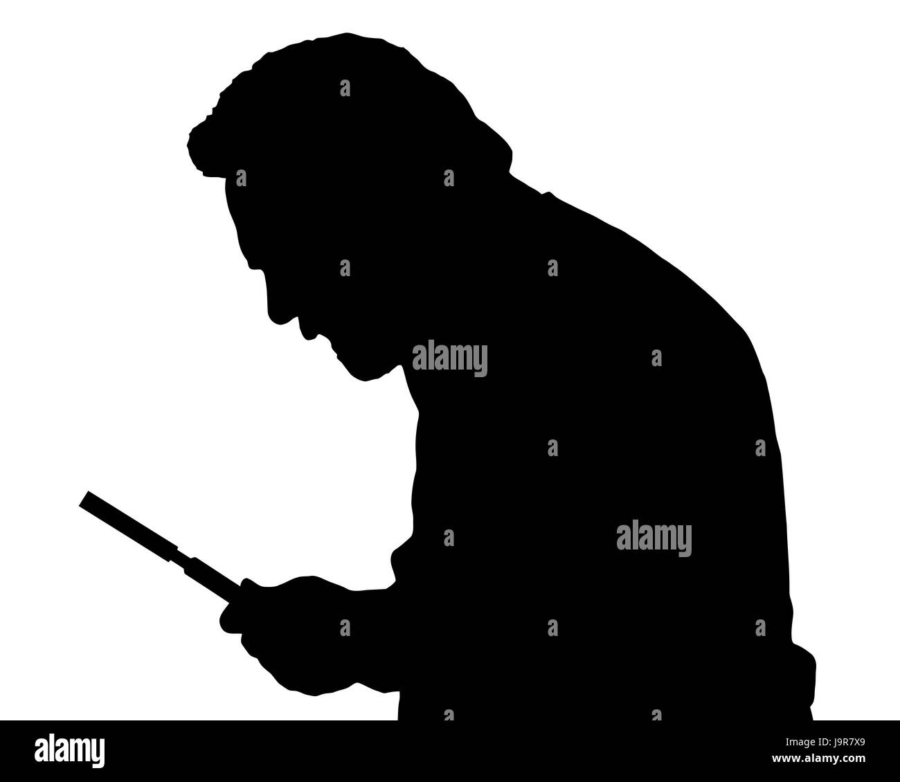 Silhouette of a bearded man investigating with a magnifying glass Stock Photo