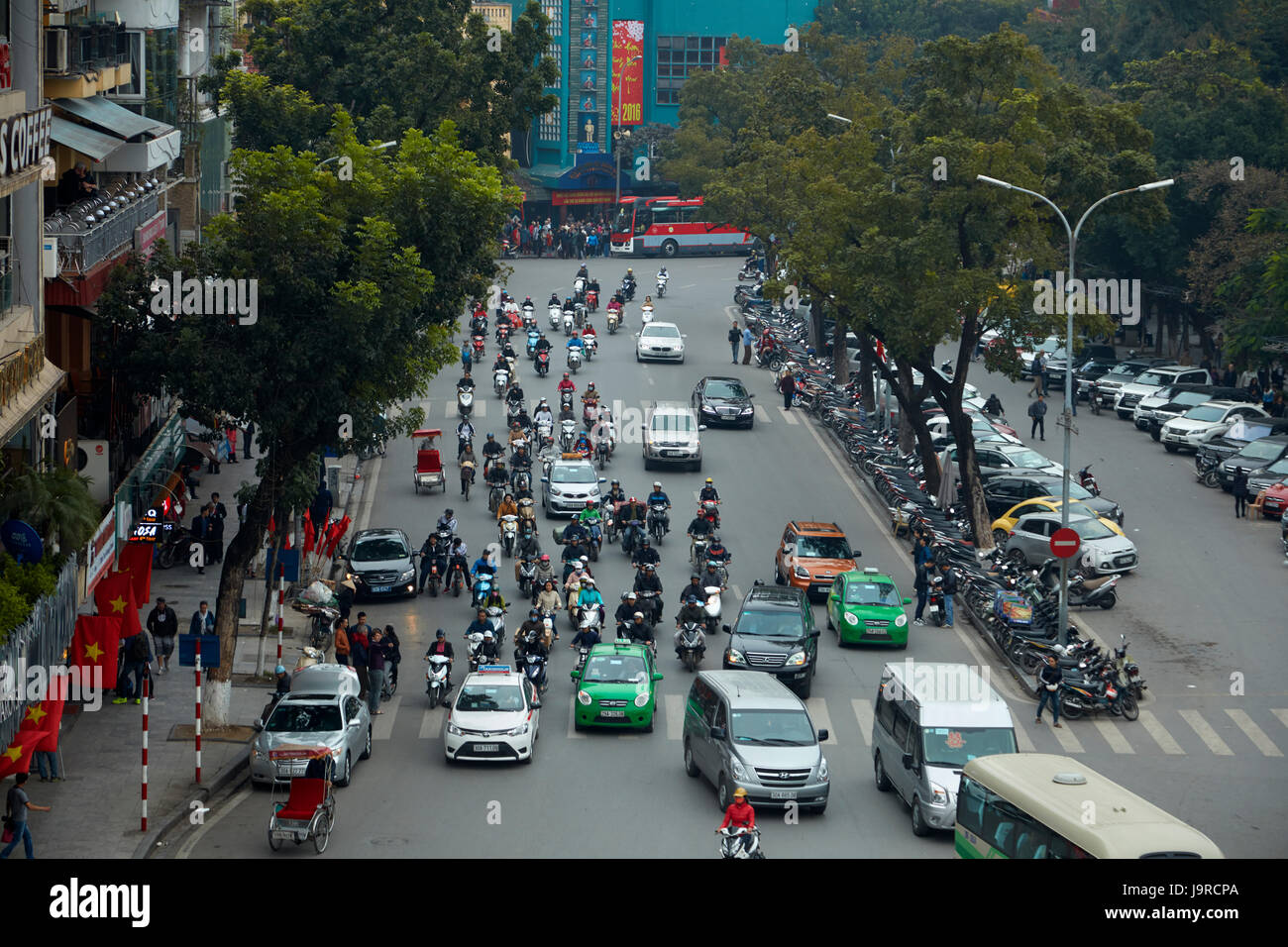 Busy street by Hoan Kiem Lake and Old Quarter, Hanoi, Vietnam Stock Photo