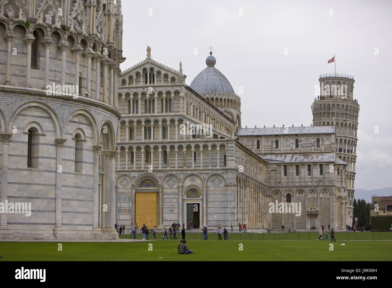 Italy,Tuscany,Pisa,Piazza del Duomo,baptistry,cathedral,oblique tower,Europe,structures,historically,architecture,bell tower,Campanile,culture,Duomo Santa Maria Assunta,church,sacred construction,church,Campo dei Miracoli,Battistero,Torre Pendente,baptismal church,person,passer-by,visitor,place of interest,landmark,curled,UNESCO-world cultural heritage,outside, Stock Photo