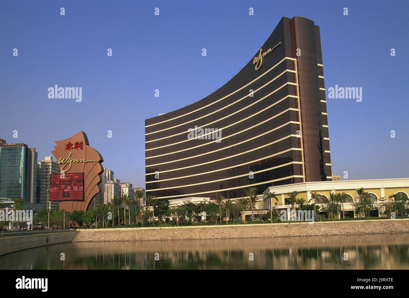 China,Macau,Wynn hotel and casino,Asia,Eastern Asia,peninsula,town,building,architecture,hotel building,modern,tourism,palms,water,water cymbals,heavens,cloudless, Stock Photo