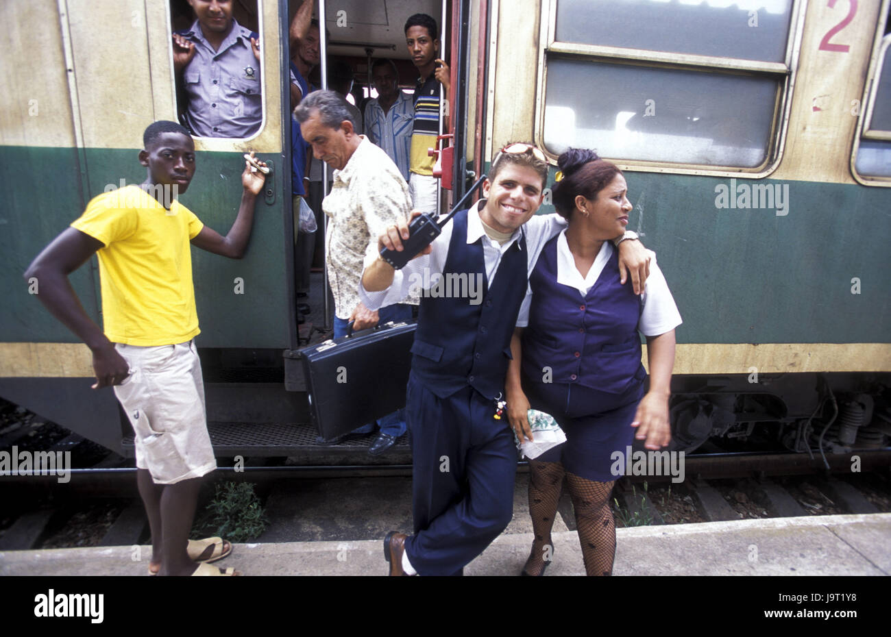 Cuba,Matanzas,railway station,train,passengers,get out,smile Schafner,conductor,no model release