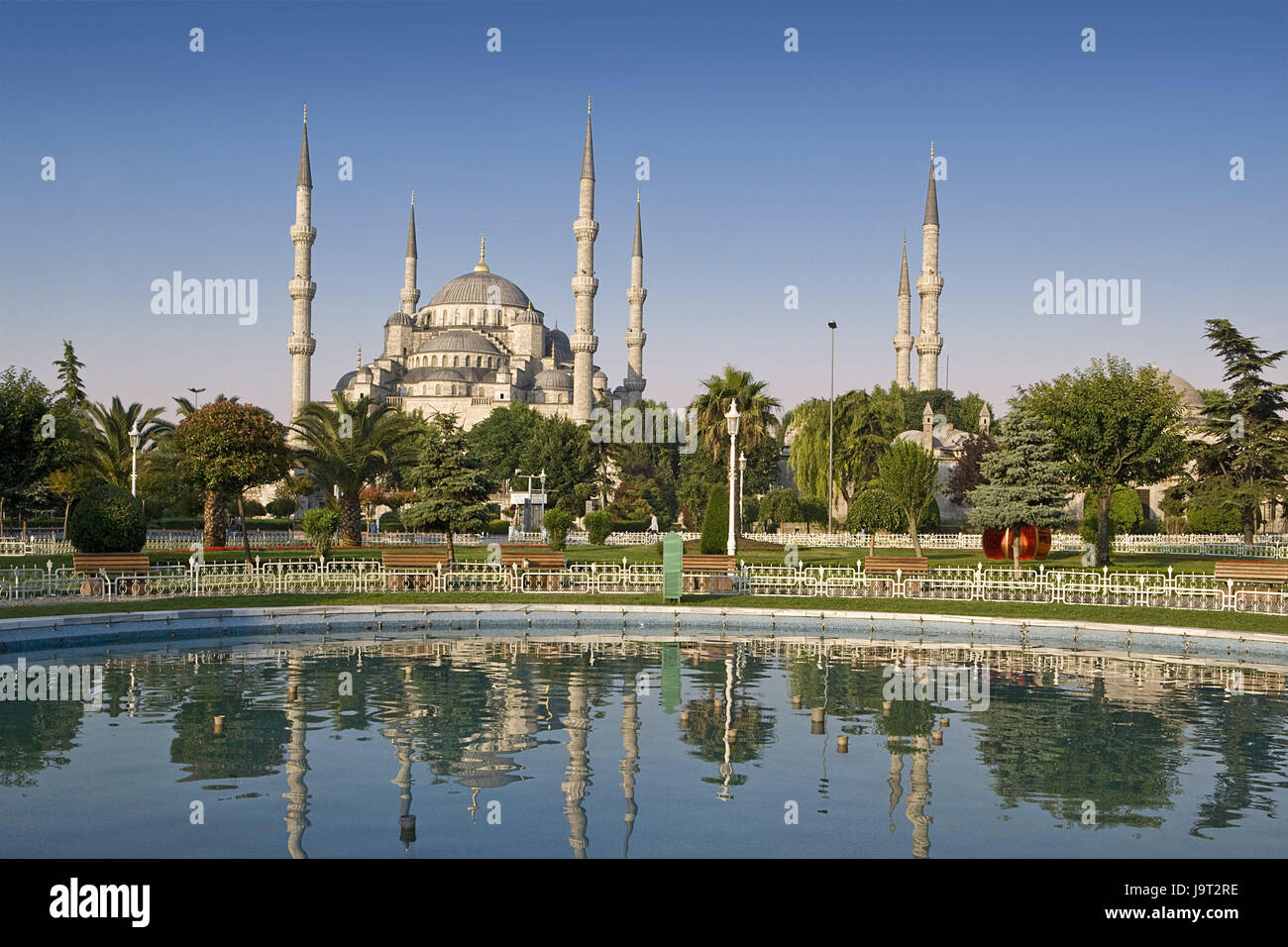 Turkey,Istanbul,sultan Ahmet Camii,'blue mosque',mirroring,water surface,town,city,metropolis,port,culture,faith,religion,Islam,structure,historically,architecture,church,sacred construction,Sultan-Ahmet-Camii,sultan's Ahmed's mosque,mosque,domed building,towers,landmarks,places of interest,minarets,domes,outside,deserted,palms,trees,water cymbals,park, Stock Photo