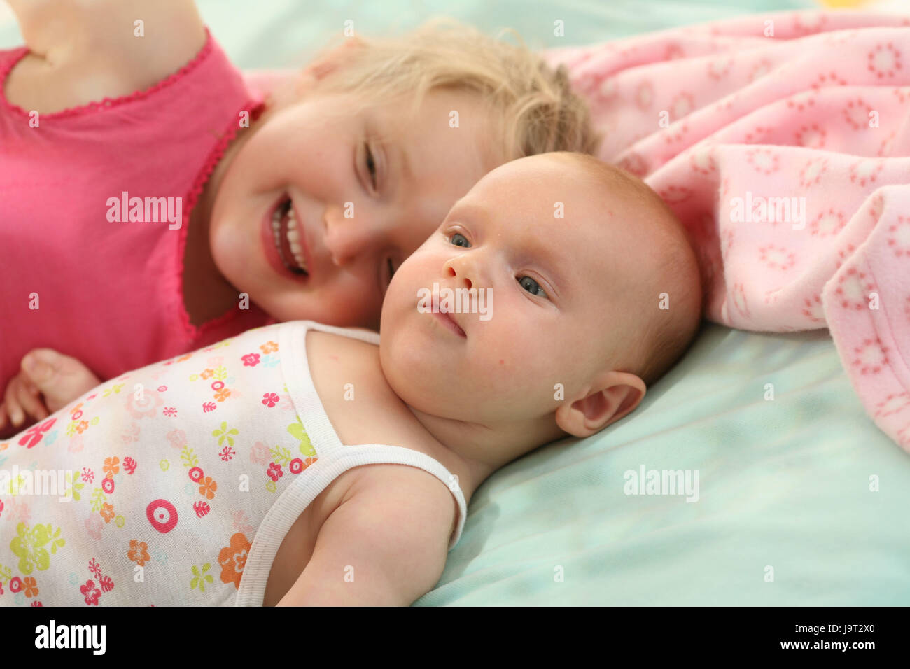 Siblings,girls,baby,cuddle,portrait, Stock Photo
