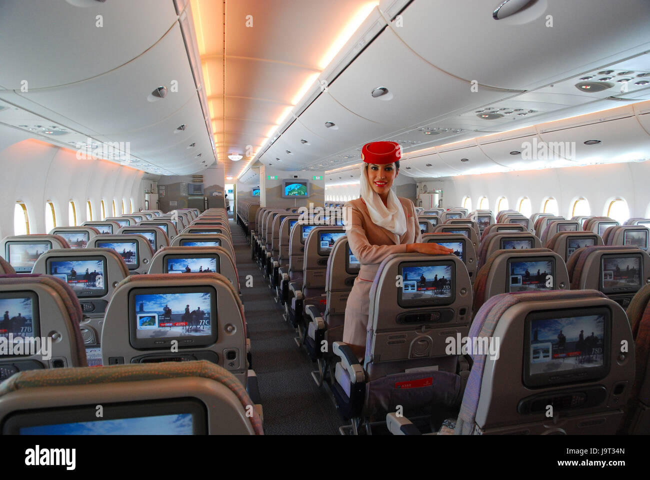 Civil aviation,air liner,airbus A380,cabin,rows,flight attendant, Stock Photo