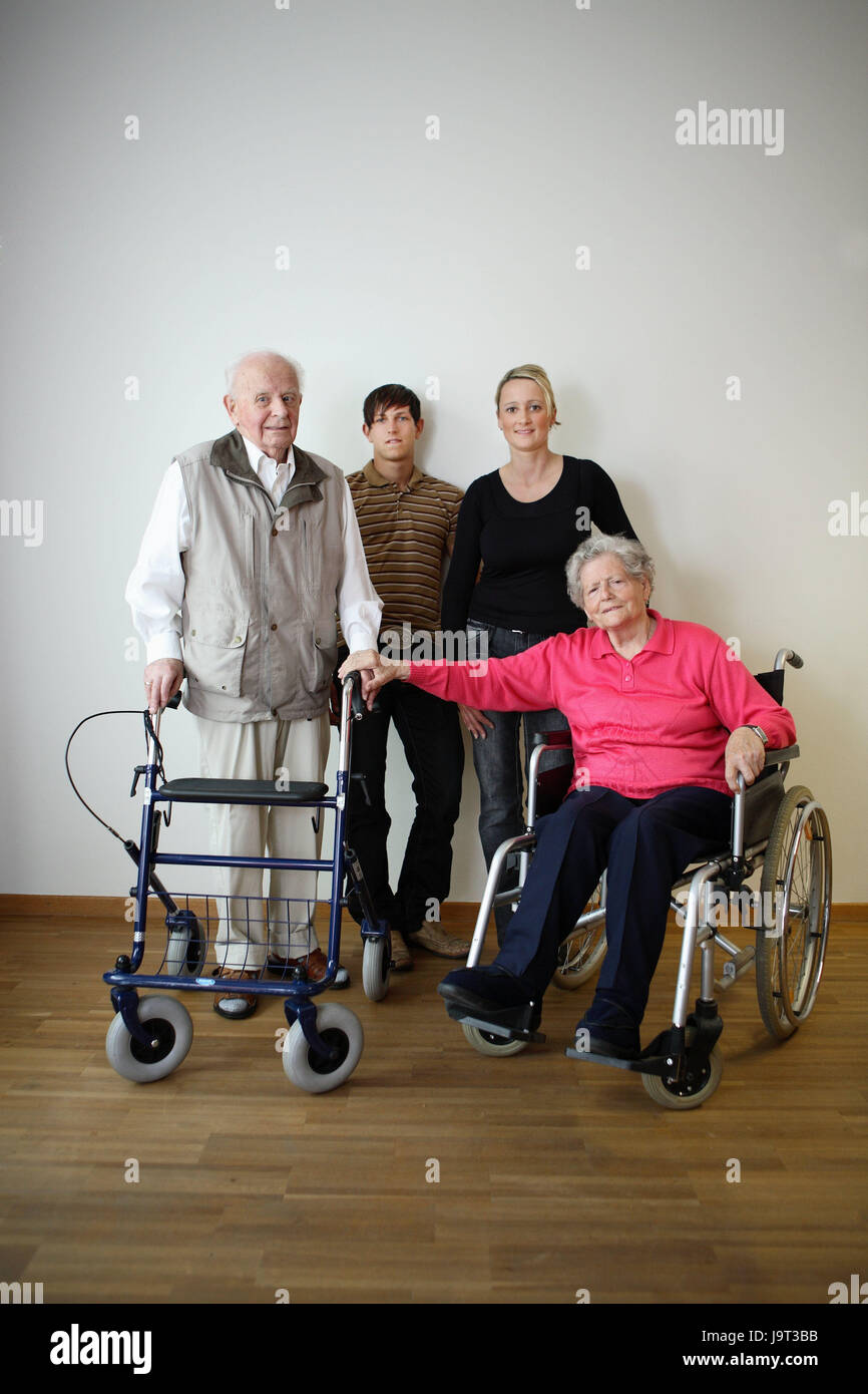 Senior citizen's couple,happily,invalid's wheel chair,walking help,grandchildren,adults,smile,people,married couple,senior citizens,couple,old,geriatric care,old care,cohesion,old age,partnership,old people's home,nursing home,disease,health,inside,care,care,grandson,visit, Stock Photo