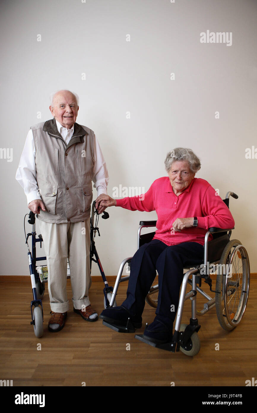 senior-citizen-s-couple-happily-invalid-s-wheel-chair-walking-help