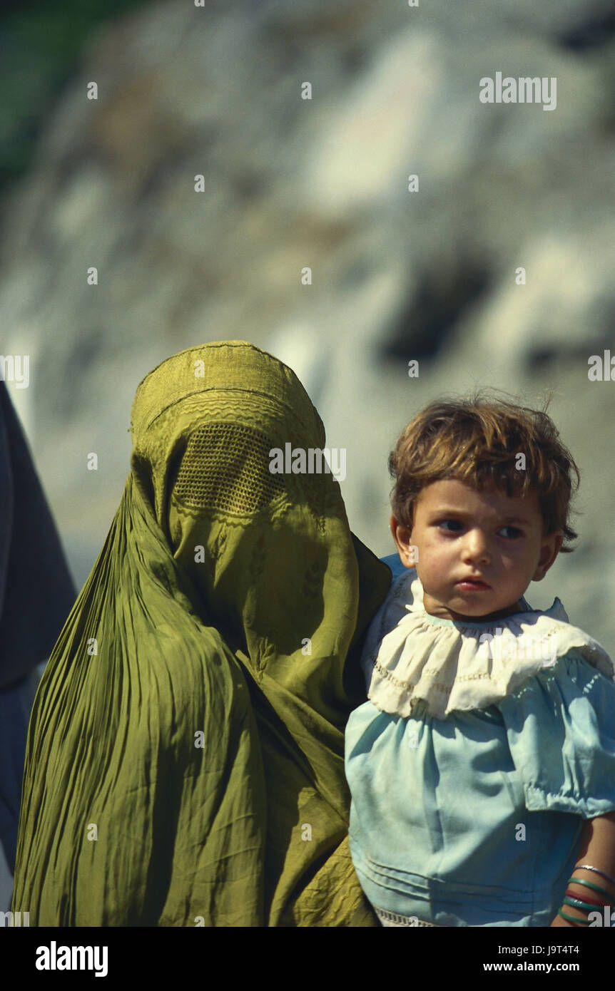 Pakistan,Chitral,woman,veils,chador,child,carry,portrait,no model release,Asia,traditions,locals,adults,Islam,clothes,infant,girl,headgear,veil,facial veil,whole body veil,person,Muslim,religion,tradition, Stock Photo