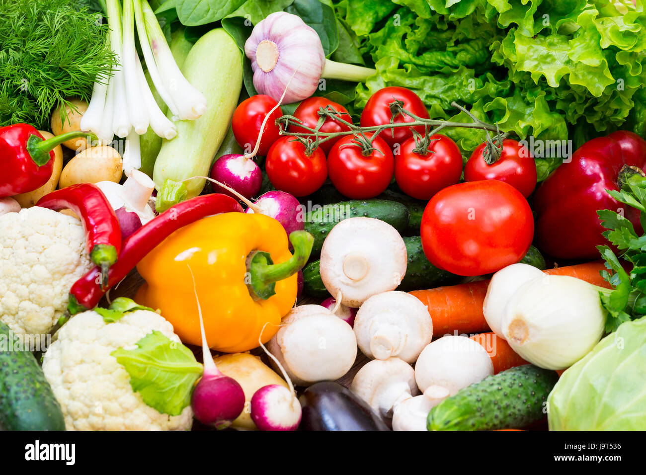 Background of fresh vegetables greens and tomatoes Stock Photo - Alamy