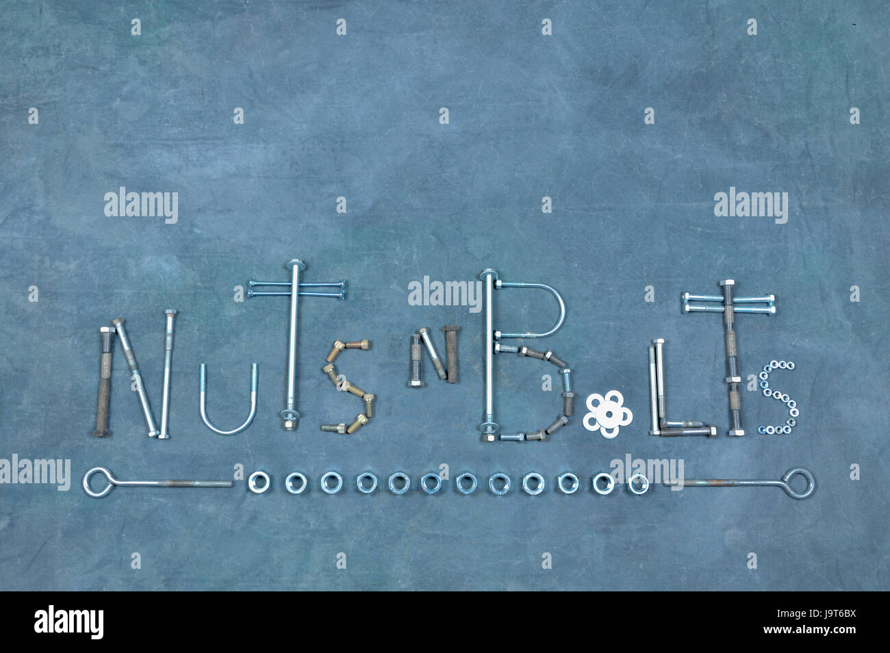 color picture of the words Nuts N Bolts made from nuts and bolts with a ...